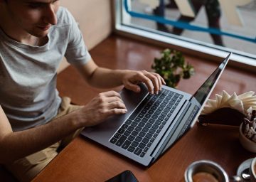 millennial-student-using-laptop-at-cafe-young-man-2022-11-12-02-05-28-utc.jpg